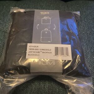Tumi Just in Case Black and Gold Backpack